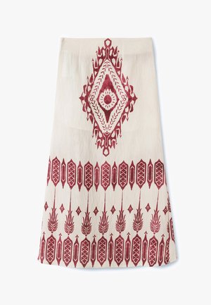 Cream-colored fabric with red geometric and floral patterns. Central diamond motif with circular detail, bordered by vertical designs at the base.