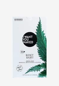 Imballaggio bianco con un grande cerchio nero e testo bianco "TI VOGLIO NUDO" e grafiche di foglie verdi. Il testo dice "RESET BABY! AROMA-BAD".