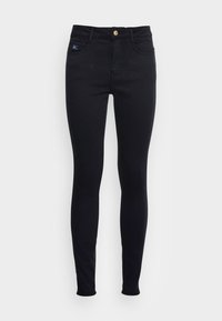 Jeans ajustados negros de denim. Cuenta con un cierre de botón, cinco bolsillos y un sutil acento de logo en la cintura. Textura suave.