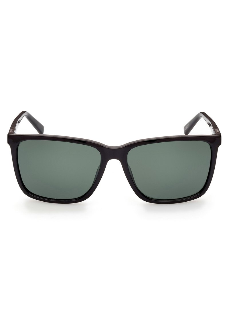 Sunglasses med en rektangulär svart ram och mörkgröna linser. Slät plastfinish med breda skalmar och minimal hårdvarudetalj.
