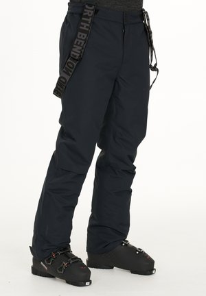 Sømands isolerede skibukser med justerbar talje, frontlynlås og forstærkede ankler. Har et mærke-straps til sikker fastgørelse.