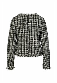 Zwart-witte tweed jack met een gestructureerde afwerking, rafelige randen, lange mouwen en een ronde halslijn. De achterkant toont het stofpatroon.