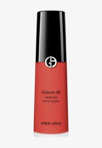 Giorgio Armani hehkuva silkkipunan tintti mattaisessa punaisessa pullossa, jossa on musta kansi. Pullossa on hopeinen logo ja mustaa tekstiä sivulla.