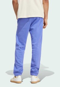 adidas Originals ESS PT - Tracksuit bottoms - semi blue