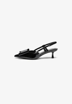 Black patent leather slingback heels with pointed toe, a bow detail on the front, and a small stiletto heel. Straps have adjustable buckles.