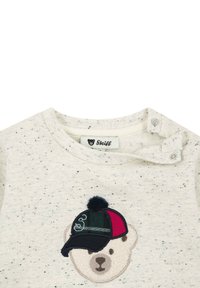 Light gray, speckled fabric top with a round neckline; features an embroidered bear face wearing a multicolored cap with a pom-pom detail.