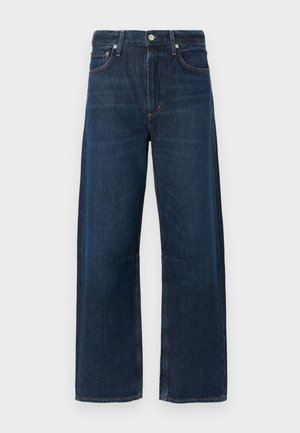 Jeans azul escuro de perna larga com fecho de botão, passantes para cinto e design clássico de cinco bolsos. Textura lisa de ganga com desbotamento mínimo.