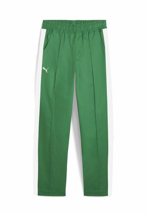 Green athletic pants with an elastic waistband, side pockets, and white side stripes. Features a small white logo on the left thigh.