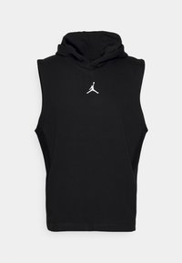 Felpa senza maniche nera in tessuto morbido, con tasca a marsupio anteriore e logo Jumpman ricamato in bianco sul petto.