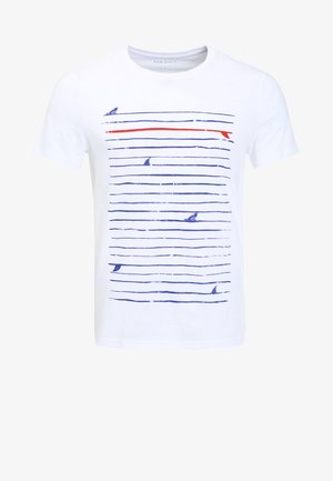 White cotton t-shirt with short sleeves, featuring horizontal blue and red lines and small blue shark graphics throughout the design.