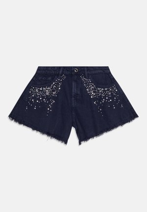 Marineblå denimshorts med frynset kant, med et bølgende mønster av klare paljetter på frontlommene og rundt midjen.