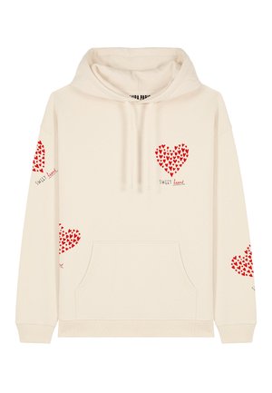 Bež kapuutsiga pusa pehmest kangast, millel on ees ja varrukatel punased südame mustrid ning tekst "Magus süda."