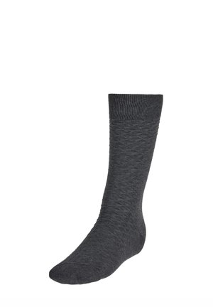 Grau gemusterte Socke mit geripptem Bündchen. Das Material scheint weich und strukturiert zu sein und zeigt ein Rautenmuster über den gesamten Sockenkörper.