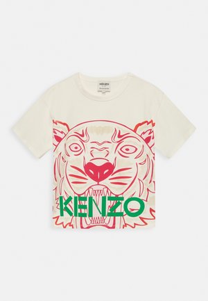 Kremowa koszula z krótkim rękawem z czerwonym wizerunkiem tygrysa i dużym zielonym napisem "KENZO" na przedzie.