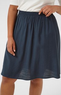 Navy blue, knee-length skirt made of lightweight fabric with an elastic waistband and subtle texture, hanging straight from the waist.