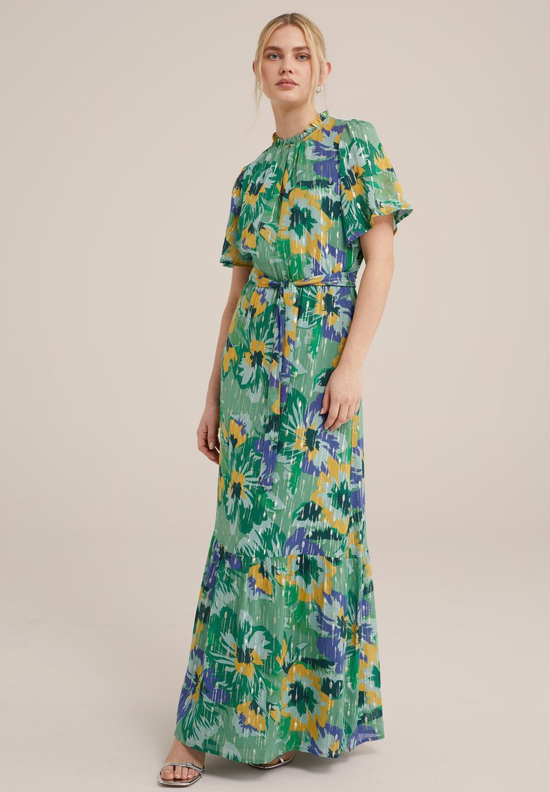 Maxikleid aus leichtem Stoff in Grün mit blumigen Mustern in Gelb und Lila. Verfügt über einen hohen Kragen, kurze Ärmel und einen Taillengürtel.