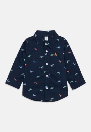 Chemise bleu marine à manches longues avec boutons, imprimés colorés de petits dinosaures et col, conçue pour les enfants.