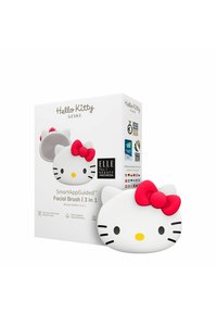 Hello Kitty ansiktsborste, vit silikon med en rosa rosett, med en rund design och förpackning som visar produktinformation och utmärkelser.