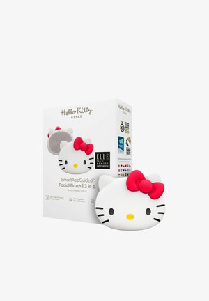Hello Kitty gezichtsborstel, witte silicone met een roze strik, met een afgerond ontwerp en verpakking waarop productdetails en prijzen staan.