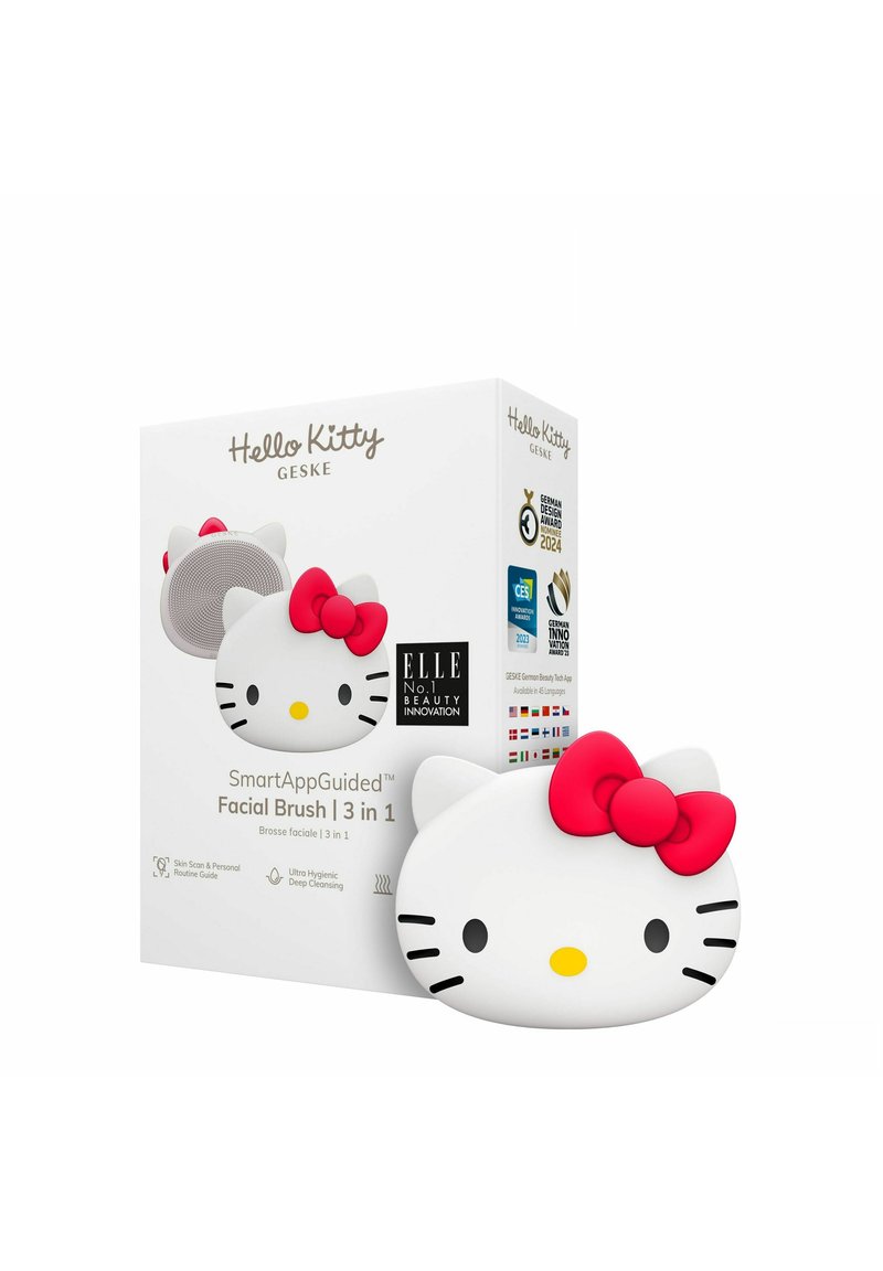 Hello Kitty ansiktsborste, vit silikon med en rosa rosett, med en rund design och förpackning som visar produktinformation och utmärkelser.