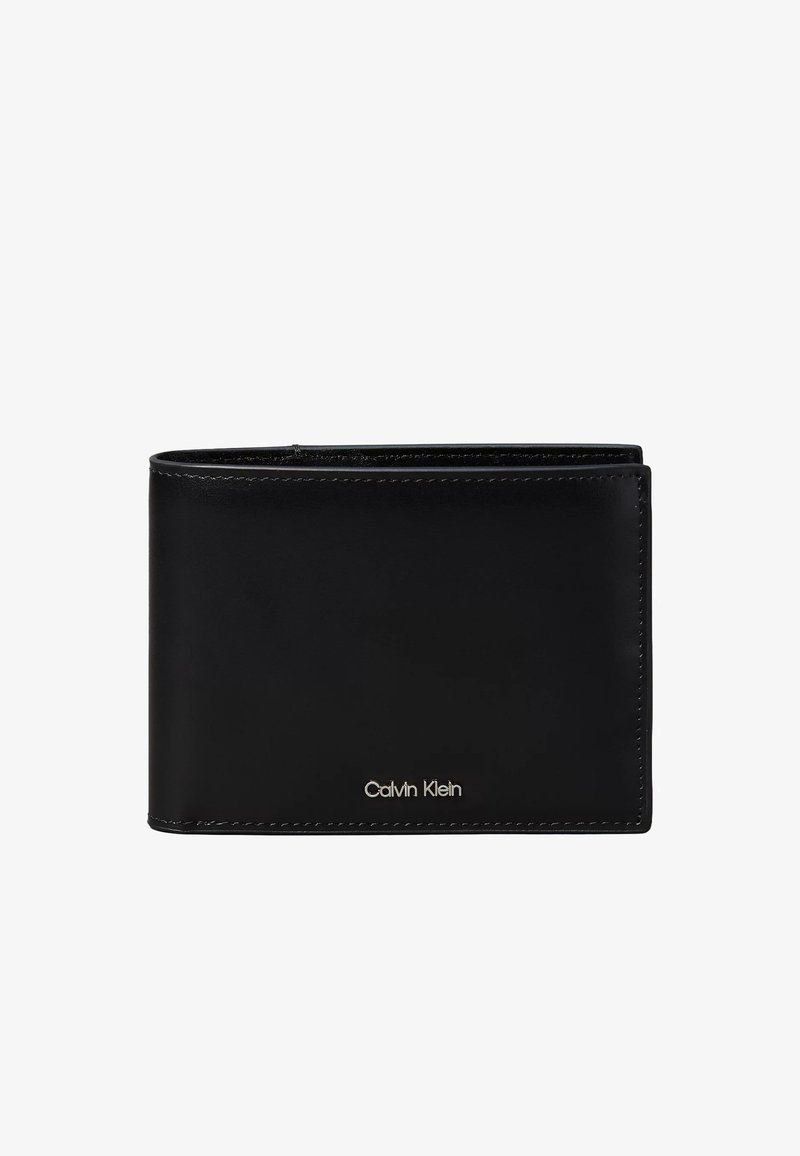 Black leather bifold wallet with stitched edges and small silver Calvin Klein logo on the lower front center.