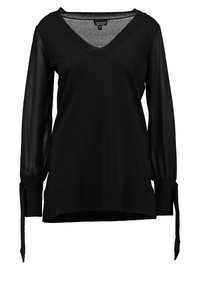 Czarna bluzka z dekoltem w kształcie litery V, długimi przezroczystymi rękawami z wiązaniami oraz ściągaczem u dołu dla uzyskania dodatkowej tekstury. Wykonana z miękkiego materiału o luźnym kroju.