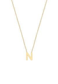 Kuldne kaelakee, millel on pealinna täht 'N', kinnitatud peene ahelaga. Kujundus on minimalistlik ja sileda viimistlusega.