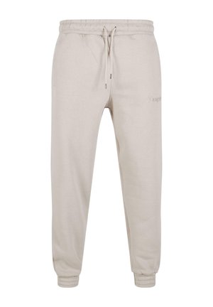 Helle beigefarbene Sweatpants aus Baumwollgemisch, mit einem elastischen Bund und Kordelzug, Bündchen an den Säumen und dezentem Logodetail.