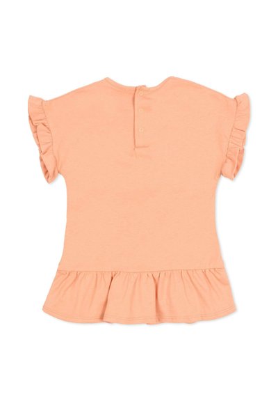 Brzoskwiniowy krótkim rękawem top dla maluchów z falbankami na rękawach i krawędzi, z trzema z tyłu zatrzaskami do zapinania.
