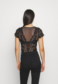 Morgan DONAO - Camiseta estampada - noir