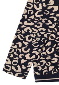 Top a maniche lunghe con stampa leopardata su sfondo blu navy e motivi beige. Presenta polsini a coste con sottili strisce all'orlo. Tessuto morbido e accogliente.