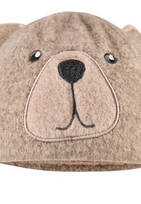 Fleece bear hat in beige and light brown, featuring embroidered facial details: eyes, nose, and mouth, with rounded ears on top.
