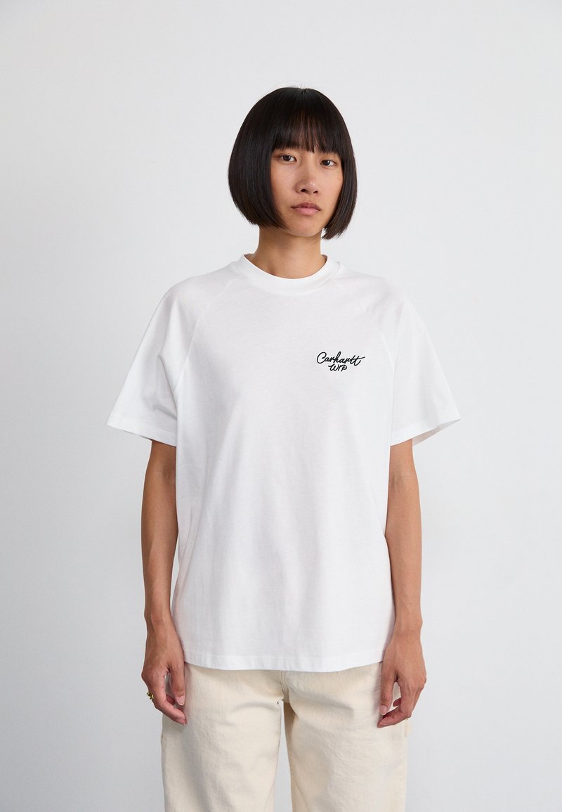 White cotton t-shirt with short sleeves, crew neck, and a small black text logo on the left chest. Relaxed fit, plain design.