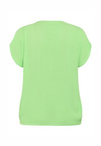 Blouse vert citron à manches courtes avec un col rond et un tissu légèrement texturé, vue de dos.