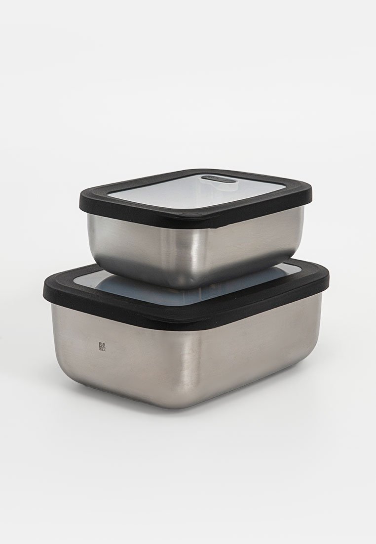Two stainless steel rectangular food storage containers stacked, each with a clear lid and black sealing rim.