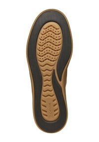 Footwear sole with a tan rubber base and black patterned tread. Features ventilation holes and a textured surface for grip. "GEOX" branding present.