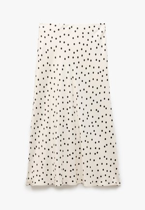 Weißer Rock mit schwarzen Polka-Dots, aus glattem Stoff gefertigt, hat ein fließendes Design und eine ausladende Form, mit einem Saum, der sanft fällt.