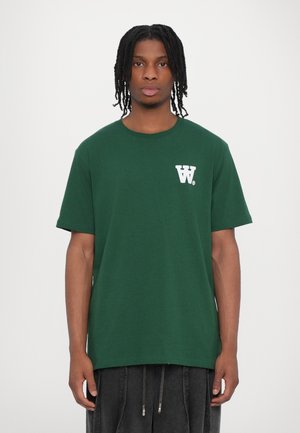 Dark green cotton T-shirt with short sleeves and a round neckline. Features a white "W" logo on the left chest. Simple and classic design.