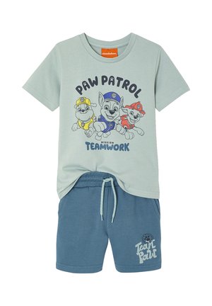 Light green Paw Patrol t-shirt with three pups and "Mission Teamwork" text, paired with blue drawstring shorts with "Team Paw" logo.