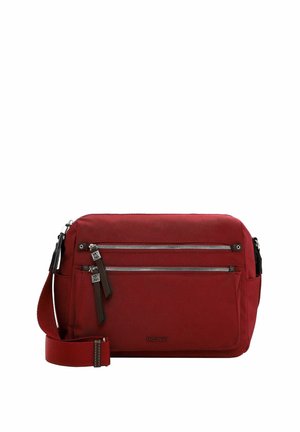 Red fabric messenger bag with an adjustable strap, two zippered front pockets, and a smooth texture. Features logo detail on the front.