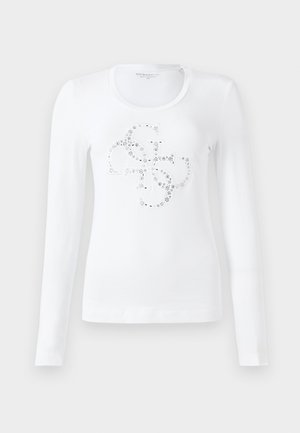 White long-sleeve t-shirt featuring a rounded neckline and a decorative pattern with metallic accents on the chest area. Soft fabric.