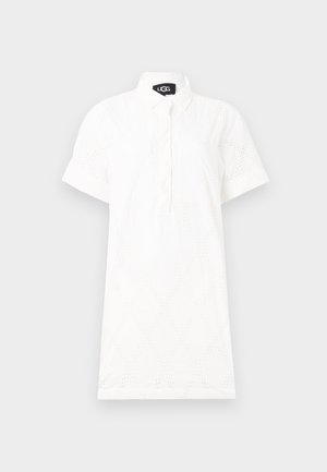 White short-sleeve shirt dress featuring a button placket, perforated diamond pattern, and a collar for a relaxed fit. Cotton blend material.