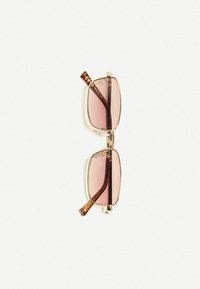 Rectangular sunglasses with light pink lenses, gold metal frame, and tortoiseshell accents on the arms. Textured design with a shiny finish.