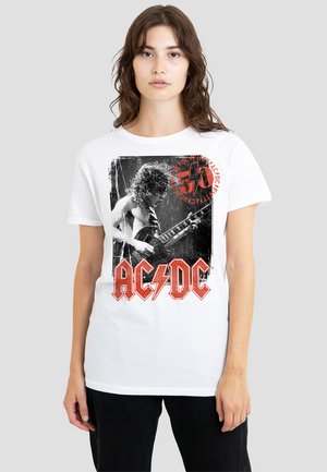 White cotton t-shirt featuring a black and white graphic of a guitarist, with red "AC/DC" logo and circular text in the top right corner.