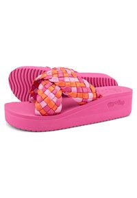 Pink flip-flops with woven straps in pink and orange. Features a textured sole and a platform design. Brand logo on side.