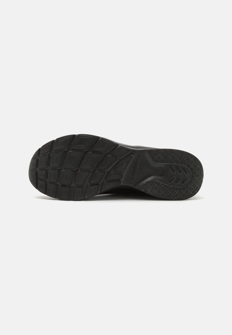 Schwarze Sportschuhsohle mit strukturiertem Muster; rechteckige und hexagonale Profilmerkmale für besseren Halt; leichtes Gummi-Material.