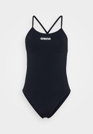 Juodas vientisas maudymosi kostiumėlis su plonomis kryžminėmis petnešėlėmis; pasižymi sklandžiu paviršiumi ir baltu "arena" logotipu priekyje.