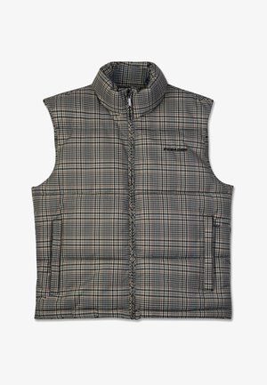 Pildīts šūnu krāsas veste ar augstu apkakli, kas aprīkota ar priekšējo rāvējslēdzēju un divām sānu kabatām. Izgatavota no sintētiska auduma neitrālās krāsās.