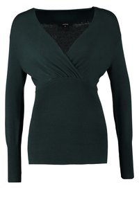 Mørkegrøn langærmet sweater med V-hals, der har et snoet frontdesign og ribbede detaljer i taljen for en tætsiddende pasform.