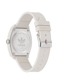 Bijela silikon remen sa satom s heksagonalnim kućištem, stražnjim dijelom od nehrđajućeg čelika i ugraviranim Adidas logom. Teksturirani remen i detalj srebrne kopče.